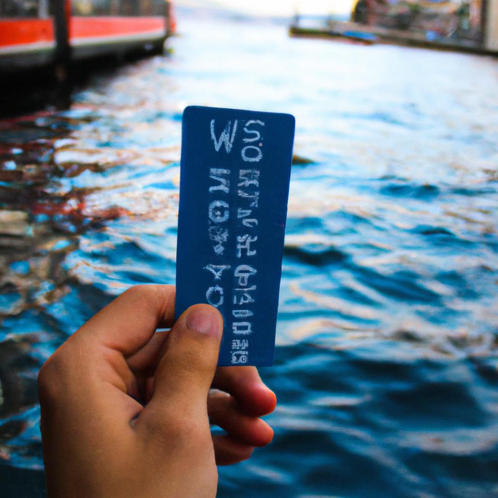 Person holding water bus ticket